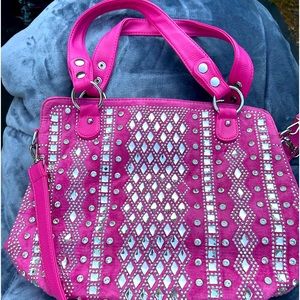 Faux suede &leather.  This Pink bag is one of a kind.  Has a long strap.